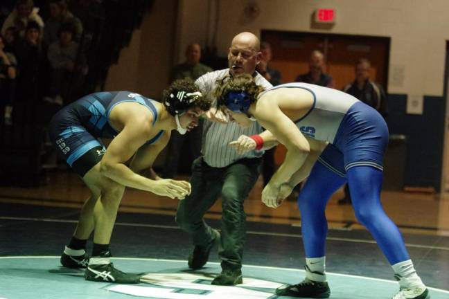 Sparta's Lucas Brown, left, faces Kittatinny's Alex Laoudis in the 215-pound weight class. Brown won by ultimate tie breaker, 3-2, on Jan. 26..