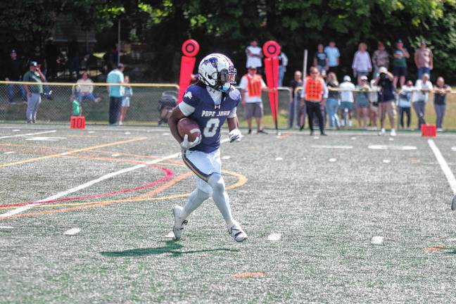 <b>Pope John kick returner Prince Joshua is on the move. (Photo by George Leroy Hunter)</b>