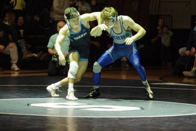 Sparta's Eugene Donnelly grapples with Kittatinny's Jacob Savage in the 144-pound weight class. Savage won by decision, 7-0, on Jan. 26.