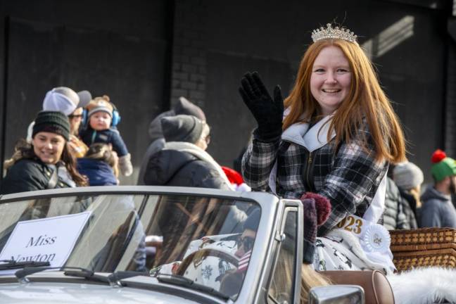 Miss Newton Abigail Gormley rides in the parade.