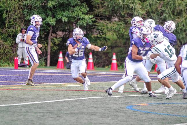 <b>Pope John running back Luke Gialanella carries the ball in the season opener against DePaul on Saturday, Aug. 30. DePaul won, 31-3. (Photo by George Leroy Hunter)</b>