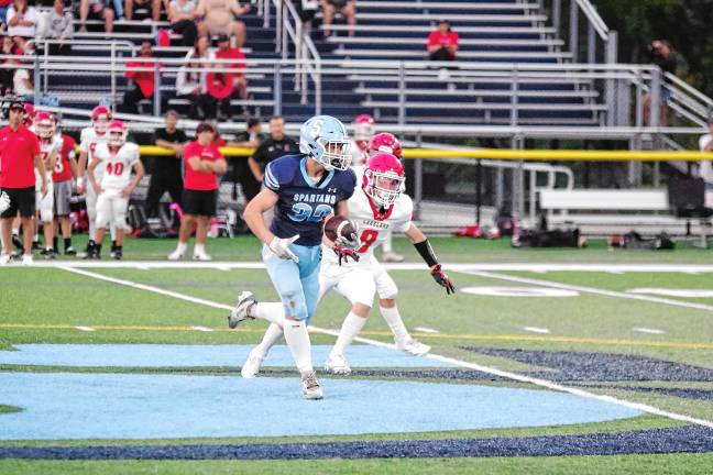 <b>Sparta High School running back Brady Shagawat on a run in the game against Lakeland at home Friday, Sept. 5. He scored two touchdowns and the Spartans won, 34-7. (Photos by George Leroy Hunter)</b>