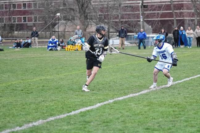 West Milford's Nash Appell carries the ball as Kittatinny's Greyson Lobb keeps pace. Appell scooped up seven ground balls and made two assists.