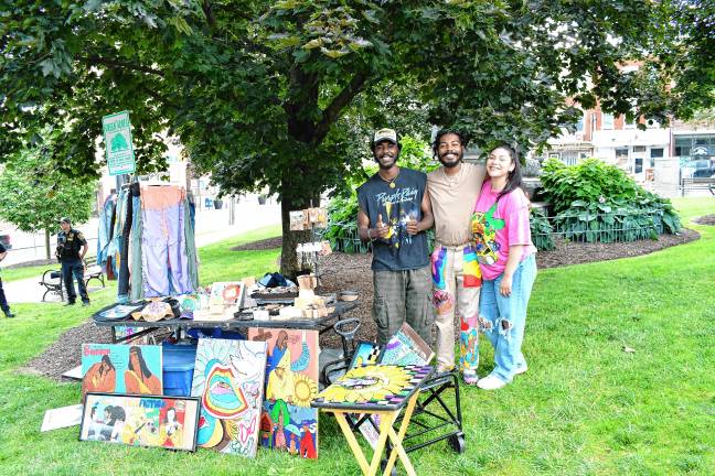 Robert and Arman Brown of North Plainfield show off the T Cozy brand clothing with Donna Sanchez of New Brunswick. (Photo by Maria Kovic)
