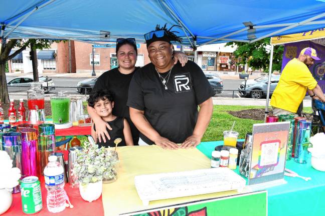 Aaron Hernandez, Rebecca Messler and Brittney McKlin, all of Stroudsburg, Pa., promote Flooid Reserve Mobile Bartending. (Photo by Maria Kovic)