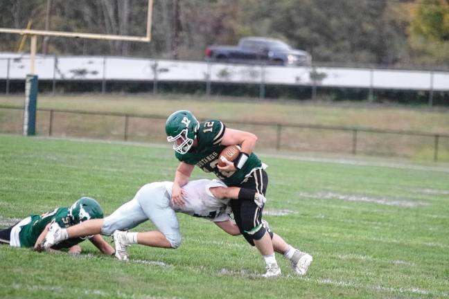 <b>Sussex Tech ball carrier Gavin Mericle is tackled by a Kittatinny defender. He made one touchdown.</b>