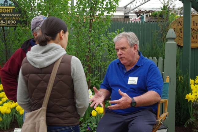 At right, longtime Springfest organizer and landscape architect David Wright of Branchville talks with visitors to the show.
