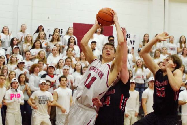 Newton's Jason Heter maneuvers towards the basket. Heter scored a game-high 25 points. Photos by George Leroy Hunter