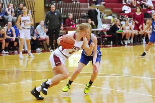 Newton's Jessie Brannick moves the ball past an opponent in the second half. Brannick scored 8 points. Brannick also grabbed 3 rebounds and made 8 assists.