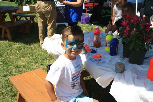 Aboody Abuhadba, age 4, has fun with face painting at Green Life Market in Andover last Saturday.