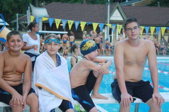 PHOTOS BY ROSE SGARLATO L to R: Lake Mohawk Pool swimmers take a break at their final meet against West Milford: Blake Winberry, Matthew Flanz, Owen Englehardt and Eric Vincelette