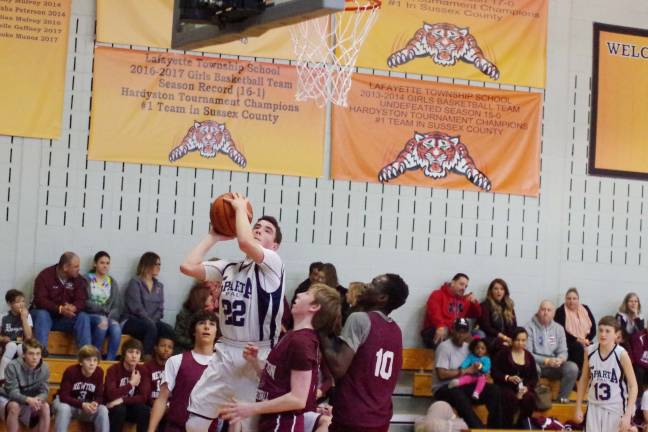 Sparta's Trey Conlee powers to the hoop.