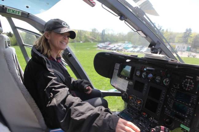 Sussex County Chamber of Commerce Membership Services Coordinator Linda Barry explores the Atlantic Ambulance Air One helictoper's controls at last year's Family Fest.