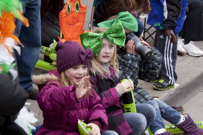 Photos by Glynnis Jones Five-year-old Lorna Jastrebski and 10-year-olds Erin Campbell and Lily Jastrebski of Branchville, wave to parade marchers.