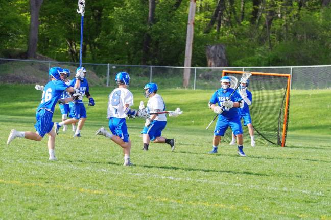 Kittatinny Cougar Austin Seames moves the ball towards the Hawthorne Bears goal post. Seames scored one goal and picked up five ground balls.