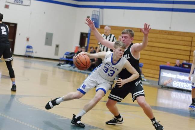 Kittatinny's Tanner Rossi dribbles the ball past Wallkill Valley's Ryan Nugent late in the second half. Rossi scored 28 points.