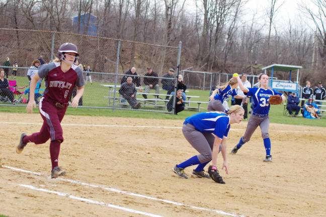 Nutley runner Lauren Hogan attempts to beat Kittatinny pitcher Alexis Cooke's throw to first base. Photos by George leroy Hunter