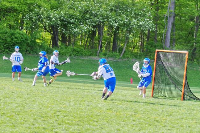 Kittatinny's Josh Vela uses his crosse to reach for the ball. Vela picked up one ground ball.