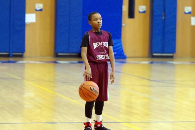 Newton's Darrell Mims brings the ball up.