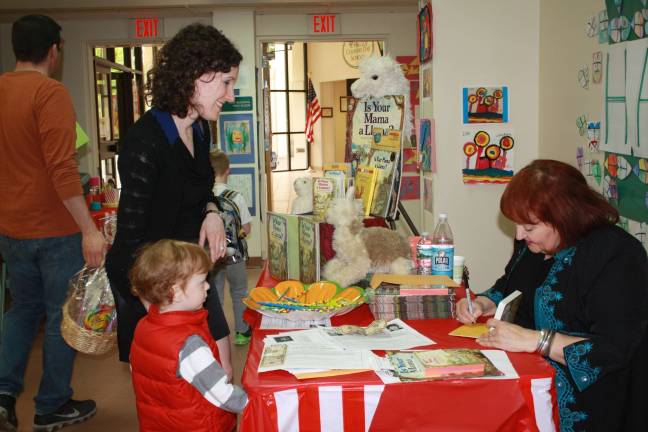 &#x201c;Is Your Mama a Llama?&#x201d; author Deborah Guarino signs her book for Hilltop parent Jennifer Pavelko and incoming student Justin Pavelko.