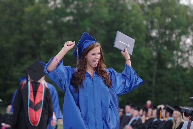 A Kittatinny Regional High School graduate excited after receiving her diploma.