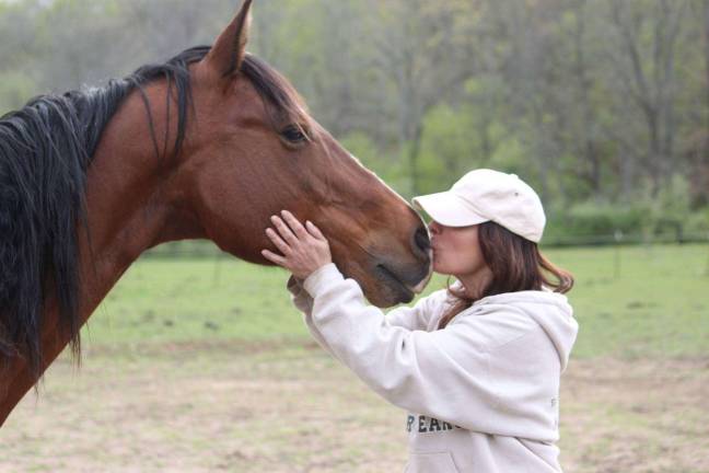 Diane Romano-Potocki with one of her beloved rescued horses.