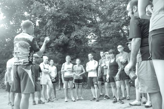 Robbie Davidson, on left, gives a pep talk to the Salt Shakers before they hit the trail.