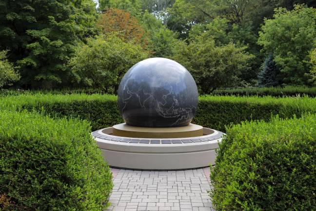 Orange County Arboretum’s Remembrance Walkway and Garden memorializes the 44 residents from Orange County, NY, who perished on September 11, 2001. Their names are listed on plaques surrounding a globe-shaped fountain centered in a secluded garden. Photo by Aja Brandt