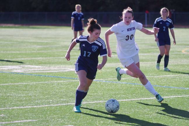 Sparta's Savannah Rode and Newton's Kaitlyn Lynch maneuver near the ball.