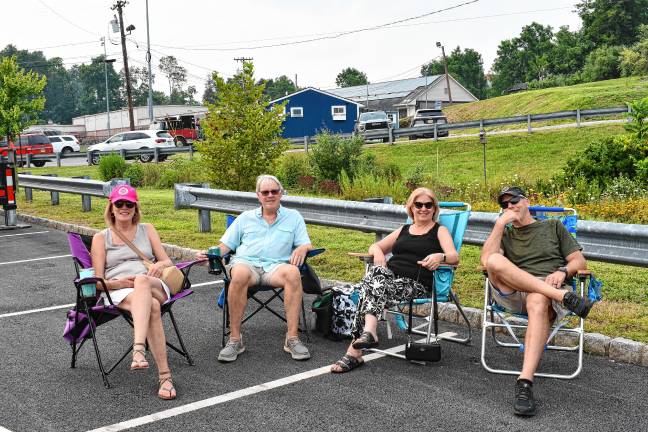 Maureen and Eldon Watson and Tricia and Rob MacEwen, all of Succasunna, listen to the music.