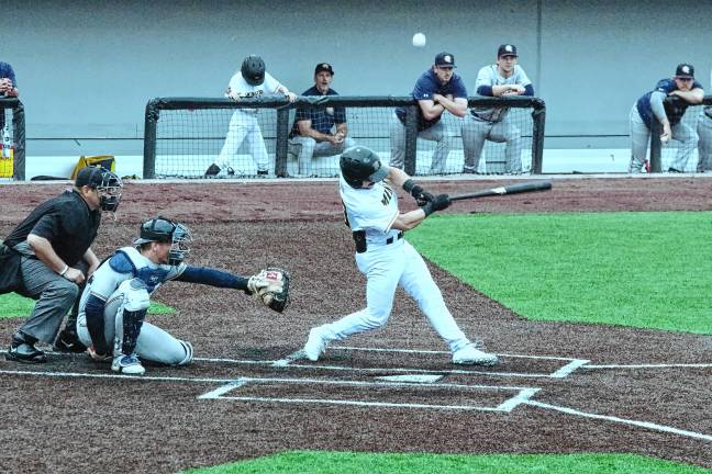 <b>Miners batter Will Zimmerman hits the ball into foul territory in the third inning.</b>