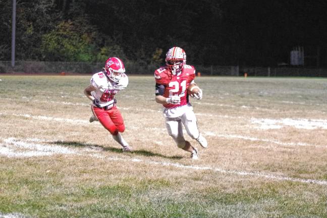 <b>High Point ball carrier Brendon Lehman is pursued by Lenape Valley defender Jacob Alderson in the first half.</b>