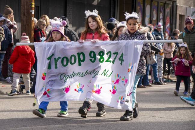 Members of Girl Scout Troop 98274 of Ogdensburg march in the parade.