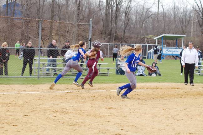 Kittatinny pitcher Alexis Cooke tags out a Nutley runner during a rundown in the fifth inning.