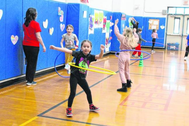 AH4 Students exercise with hula hoops as part of the Kids Heart Challenge fundraiser.