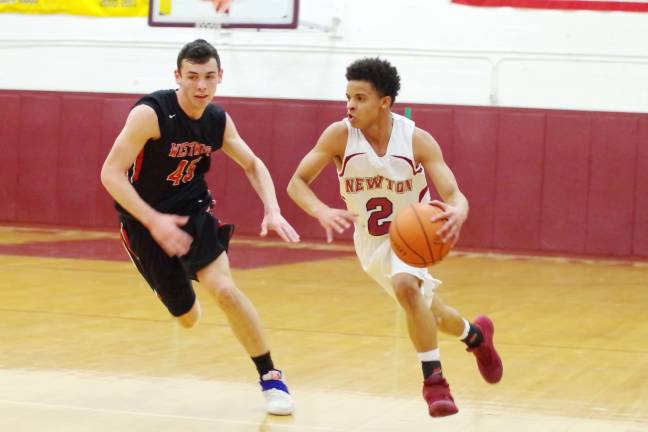 Westwood's Joe Paulillo tries to keep pace with Newton's Luismy Arias.