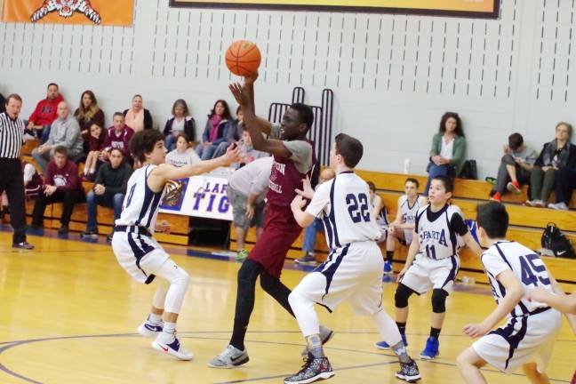 Newton's Michael Atta in a crowd of Sparta defenders.