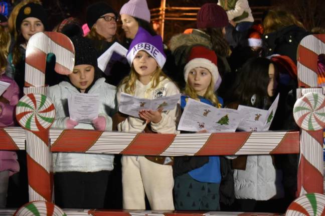 Children sing at the Christmas tree lighting Dec. 4 in West Milford. (Photo by Rich Adamonis)