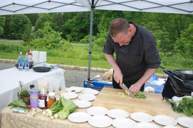 Chef Ken Salmon of Upstream Grille uses farmer market ingredients to create Montreal-crusted, Mangalista Pork over farro with turnips and ramp hash.