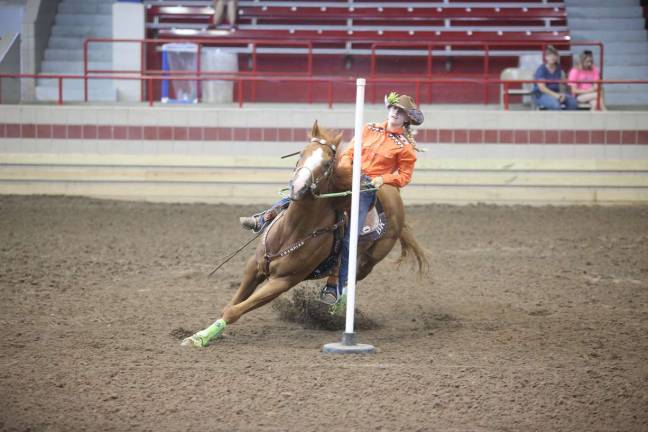Brooke and her mount pole bending Photos provided by the Klinger family