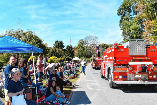 <b>ID3 Residents watch the parade of about 26 fire departments from throughout Sussex County.</b>