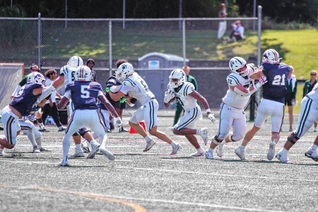 <b>DePaul ball carrier Marquan Carter (0) is on the move in the first half. (Photo by George Leroy Hunter)</b>