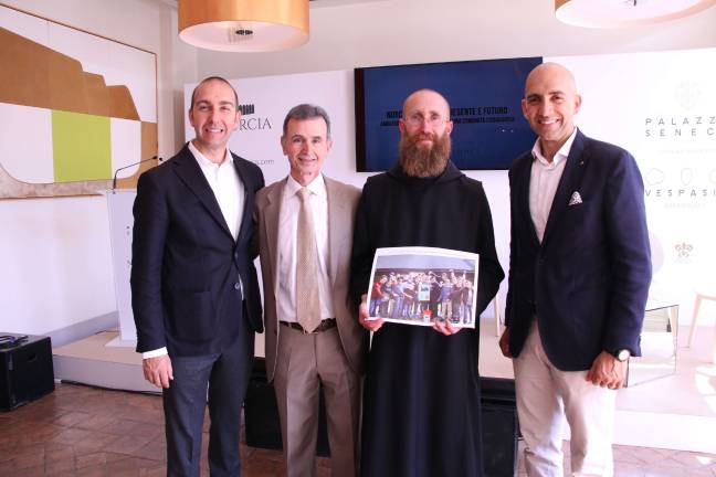 Recent press conference at Palazzo Seneca hotel in Norcia where donations were presented. From left: Federico Bianconi, St. Kateri Knight Nick Cutrone, Father Benedict Nivakoff, and Vincenzo Bianconi