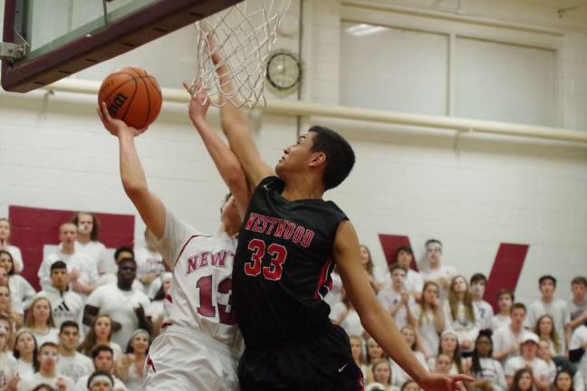 In the third period, Newton's Tarabokija is fouled by Westwood's Jordan Steward.