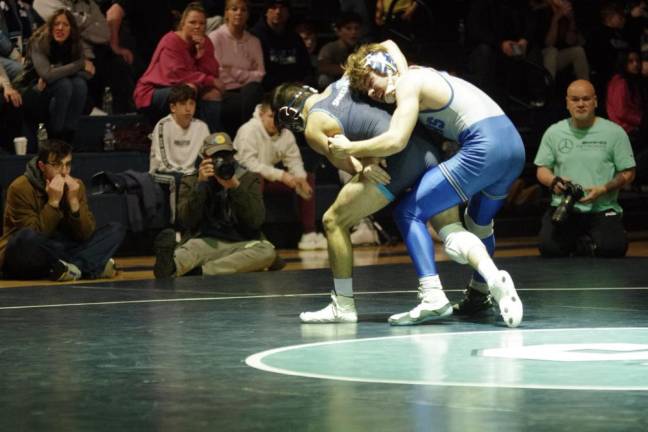 Sparta's Eugene Donnelly grapples with Kittatinny's Jacob Savage, right, in the 144-pound weight class. Savage won by decision, 7-0.
