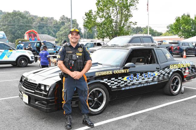 Sussex County Sheriff’s Officer James Aumick poses at National Night Out in Newton.