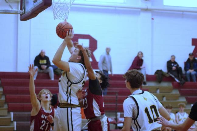 West Milford's Connor Vogt takes the ball to the hoop during a shot. He scored 10 points.