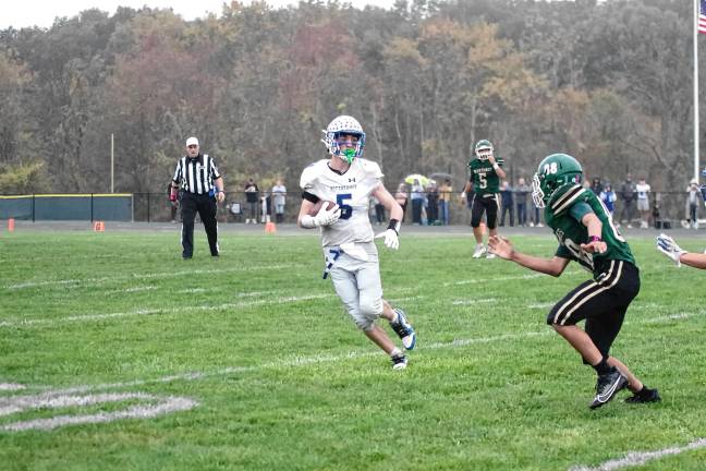 <b>Kittatinny ball carrier Mike Strong attempts to avoid a Sussex Tech defender. He made one touchdown.</b>