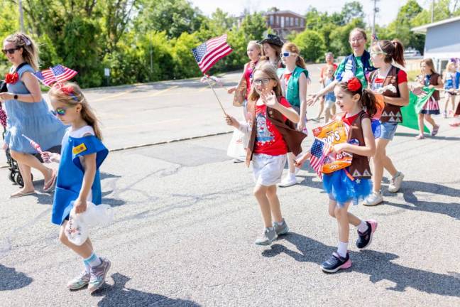 Young Girl Scouts march in the parade.