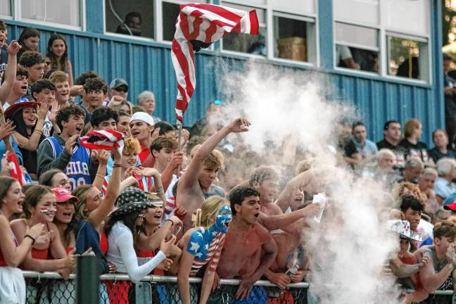 <b>Sparta football fans celebrate after their team scores a touchdown.</b>